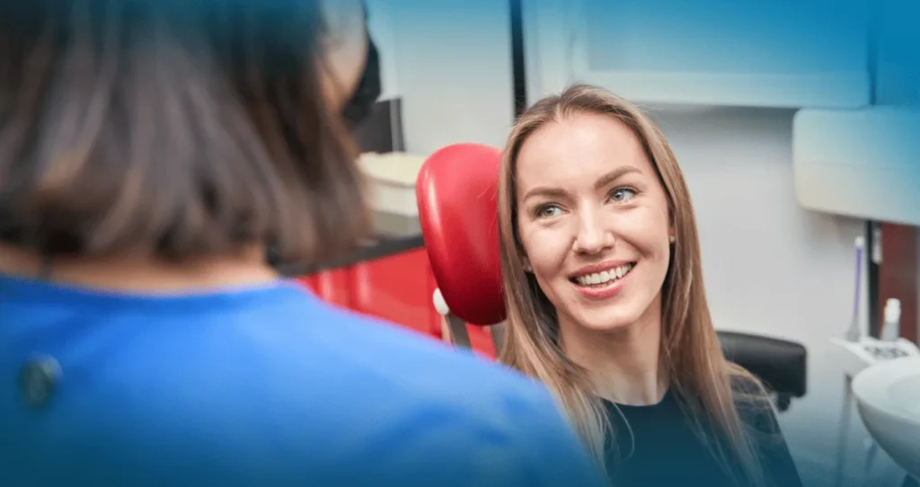Smiling patient speaking with a dental professional in a modern clinic setting, illustrating a same-day dental appointment experience in Maple, ON